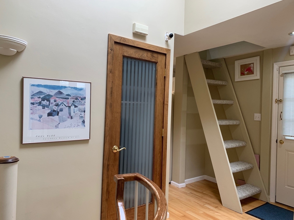 4 Potter Pond, Unit 4 Lexington, MA 02421 - Photo 9 of 15 a view of an entryway with wooden floor