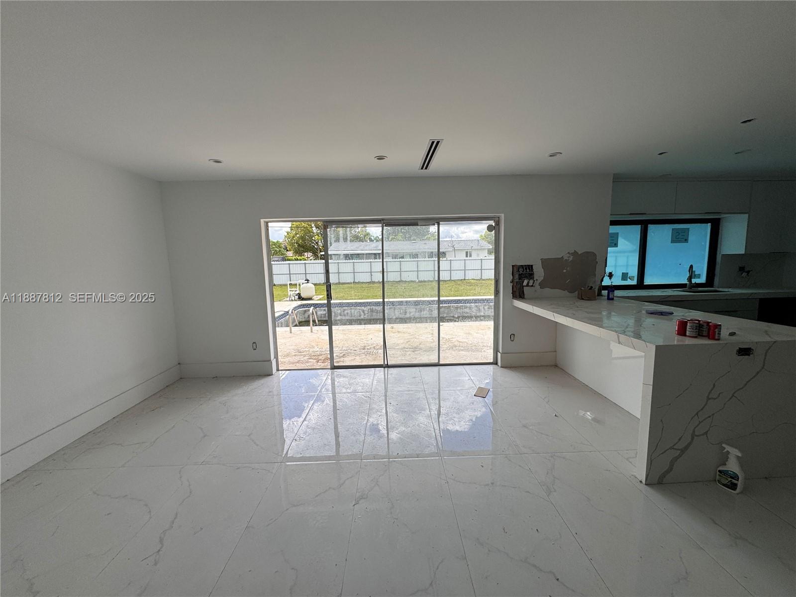 444 Northwest 21st Street Homestead, FL 33030 - Photo 17 of 22 an empty room with a cabinet and mirrors