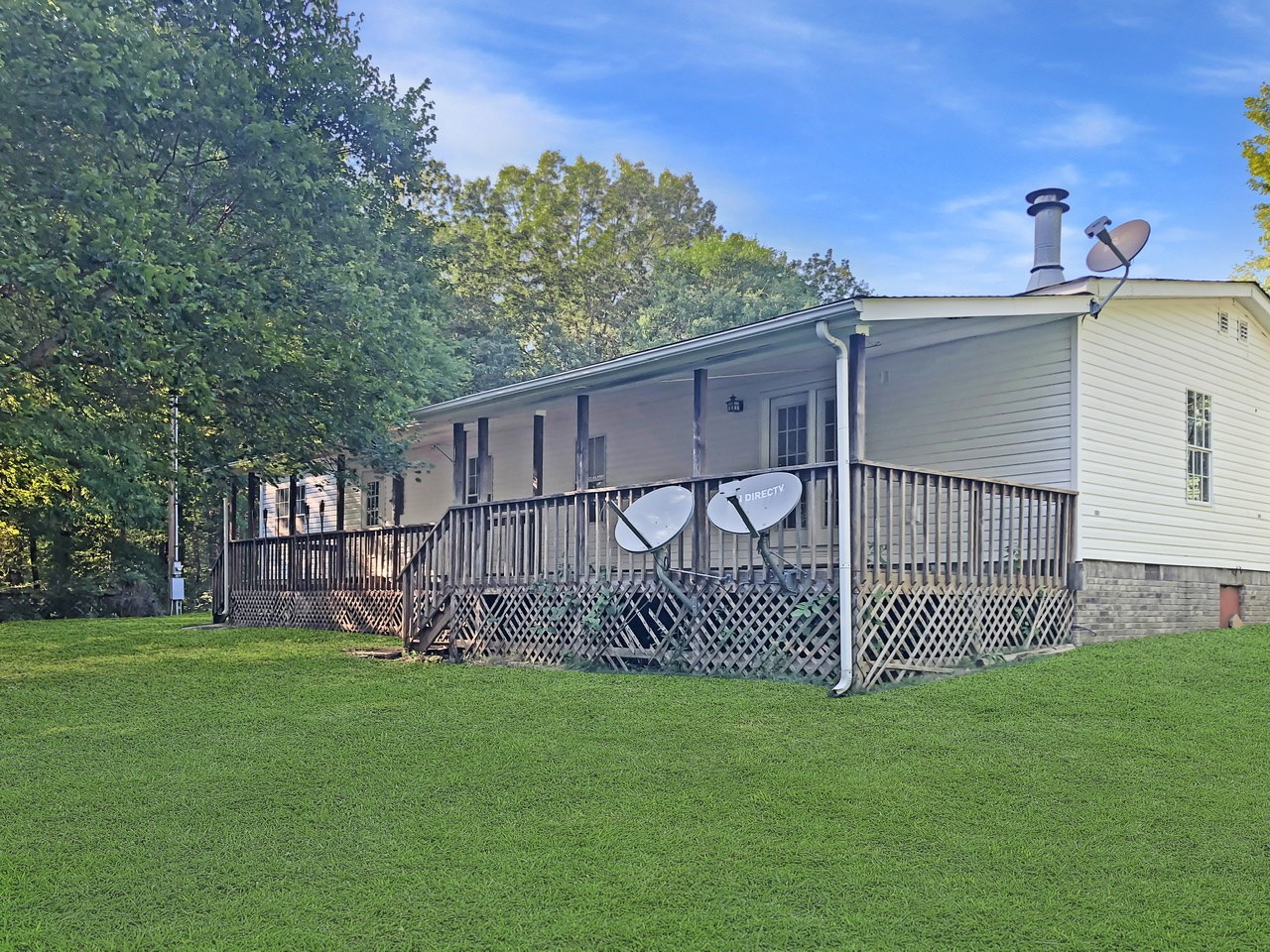 218 Watson Road Bumpus Mills, TN 37028 - Photo 3 of 23 a view of a backyard with a wooden fence