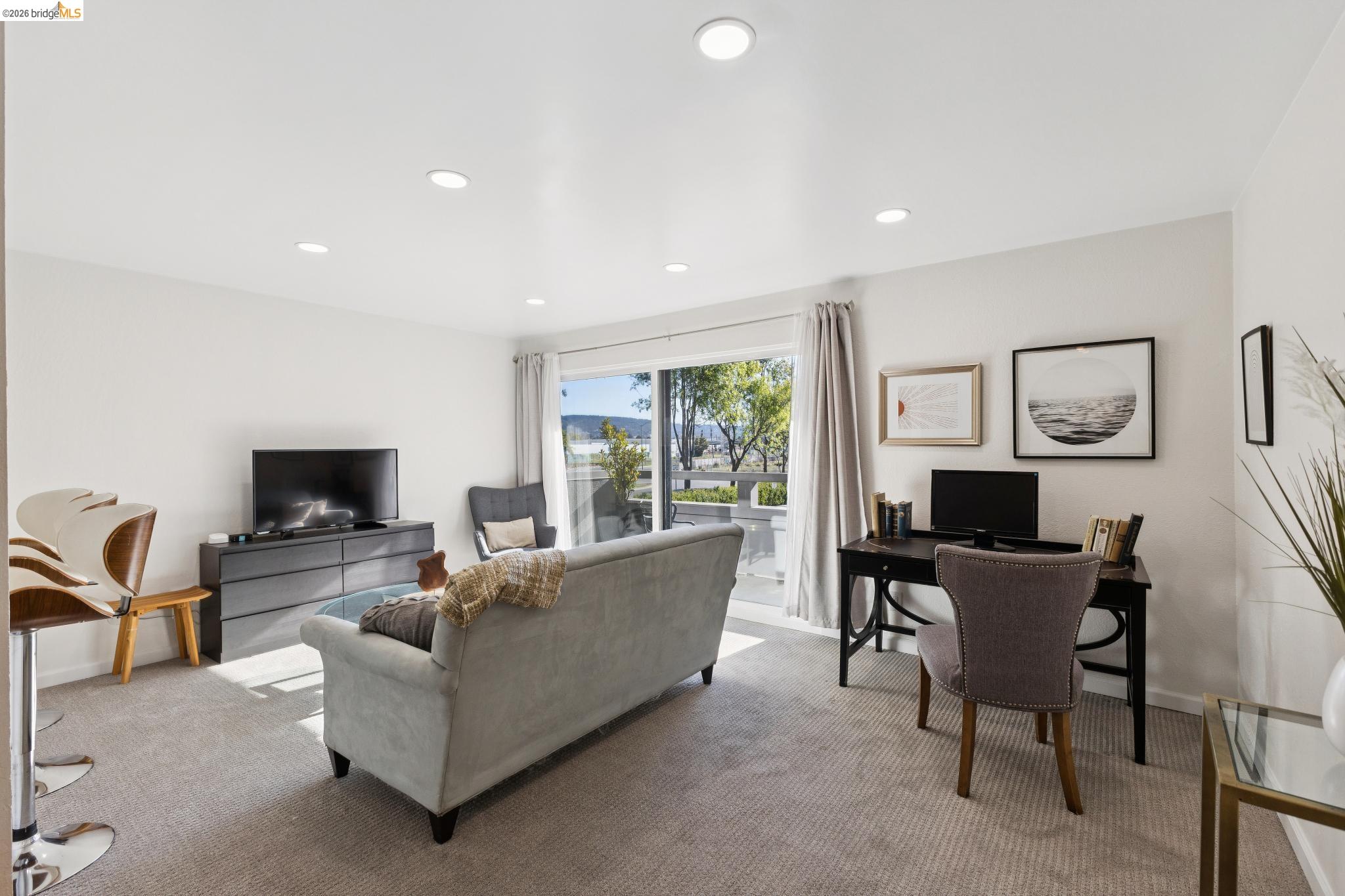 5 Embarcadero, Unit 129 Oakland, CA 94607 - Photo 14 of 32 Carpeted living area featuring recessed lighting and a desk