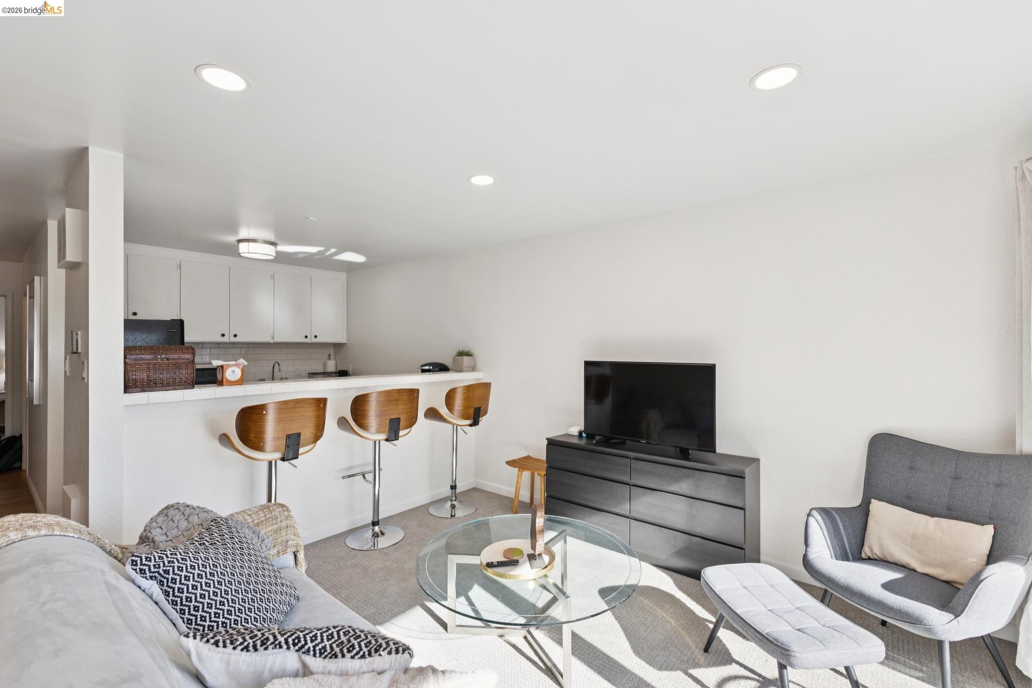 5 Embarcadero, Unit 129 Oakland, CA 94607 - Photo 8 of 32 Living room featuring recessed lighting and light colored carpet