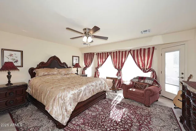 a bed room with a bed and a window