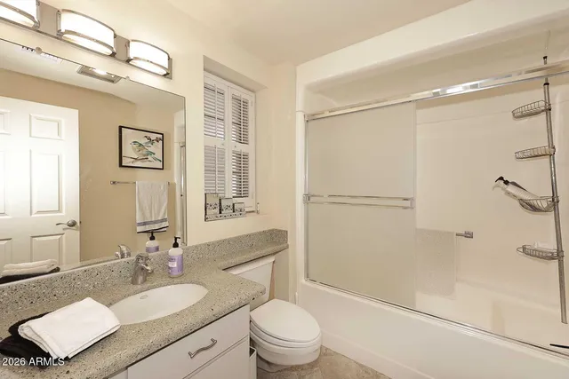 a view of a chairs and table in the patio