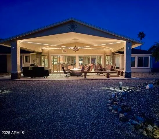 a building outdoor space with patio furniture and potted plants