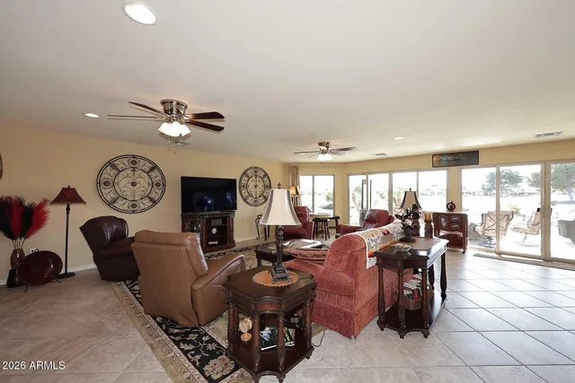 a living room with lots of furniture and white walls