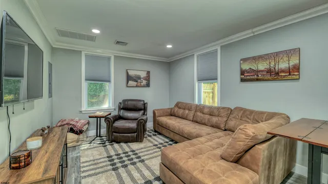 a living room with furniture and a window