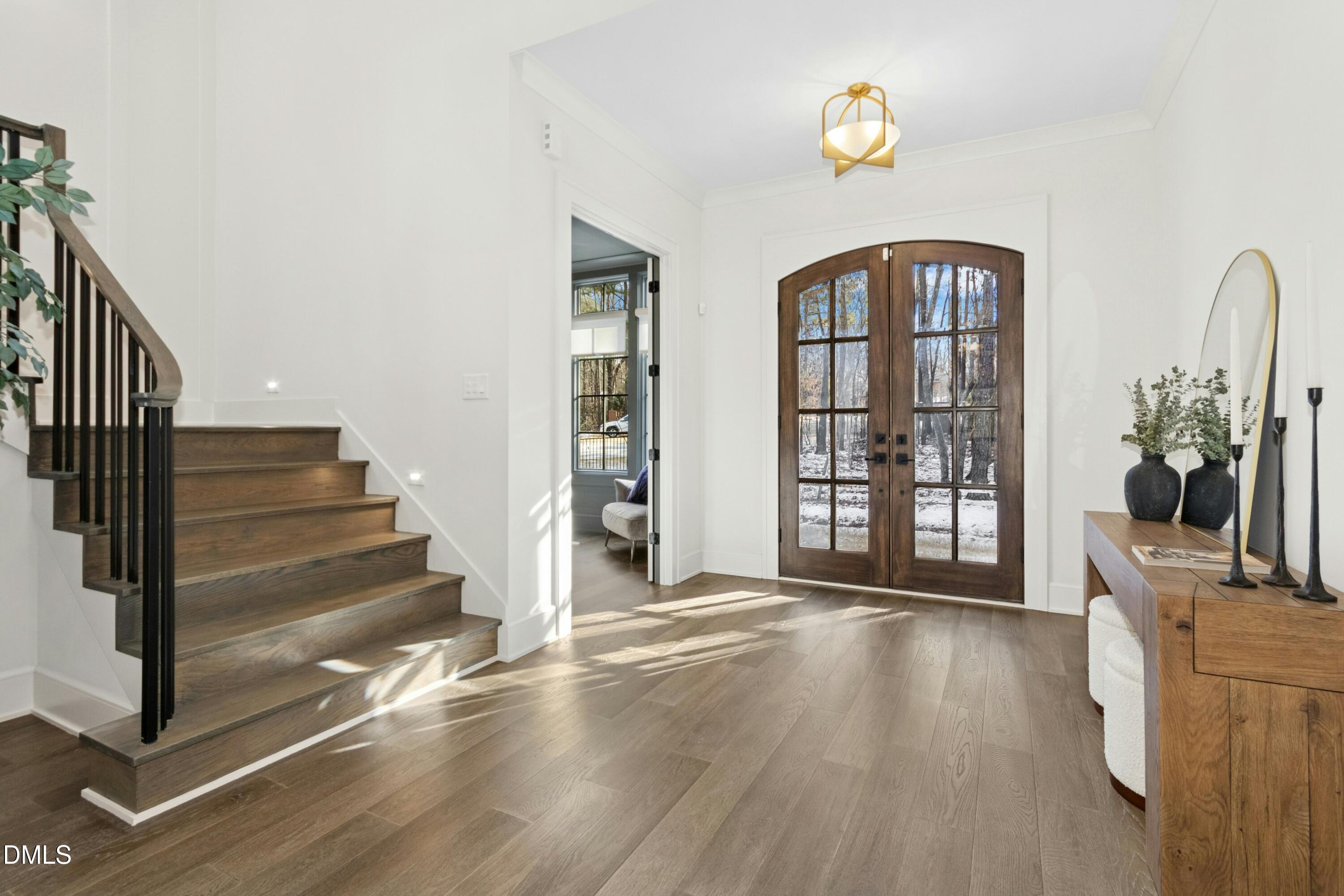 2200 Paddstowe Main Way Wake Forest, NC 27587 - Photo 3 of 55 a view of an entryway with wooden floor