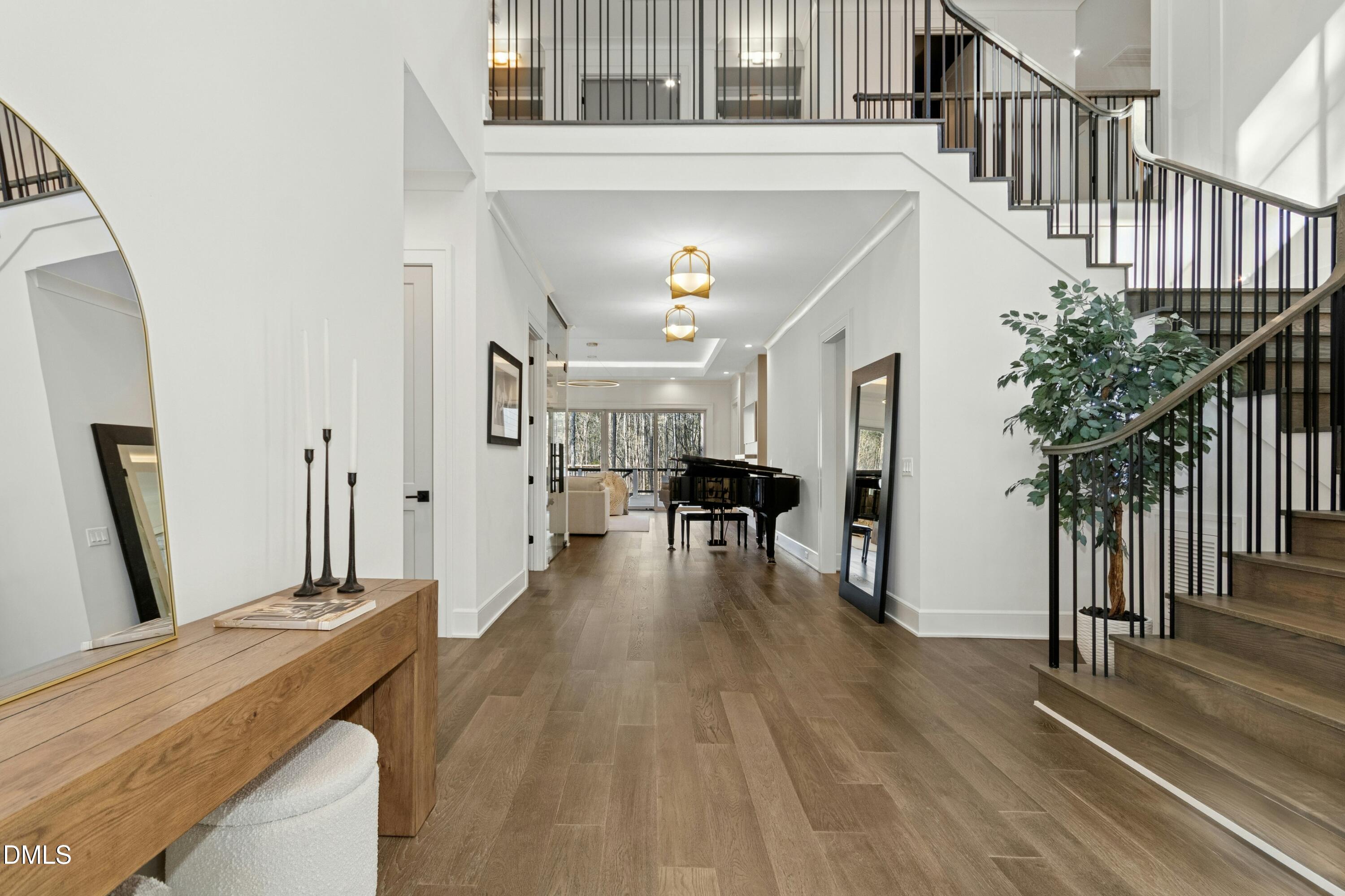 2200 Paddstowe Main Way Wake Forest, NC 27587 - Photo 4 of 55 a living room with furniture and a wooden floor