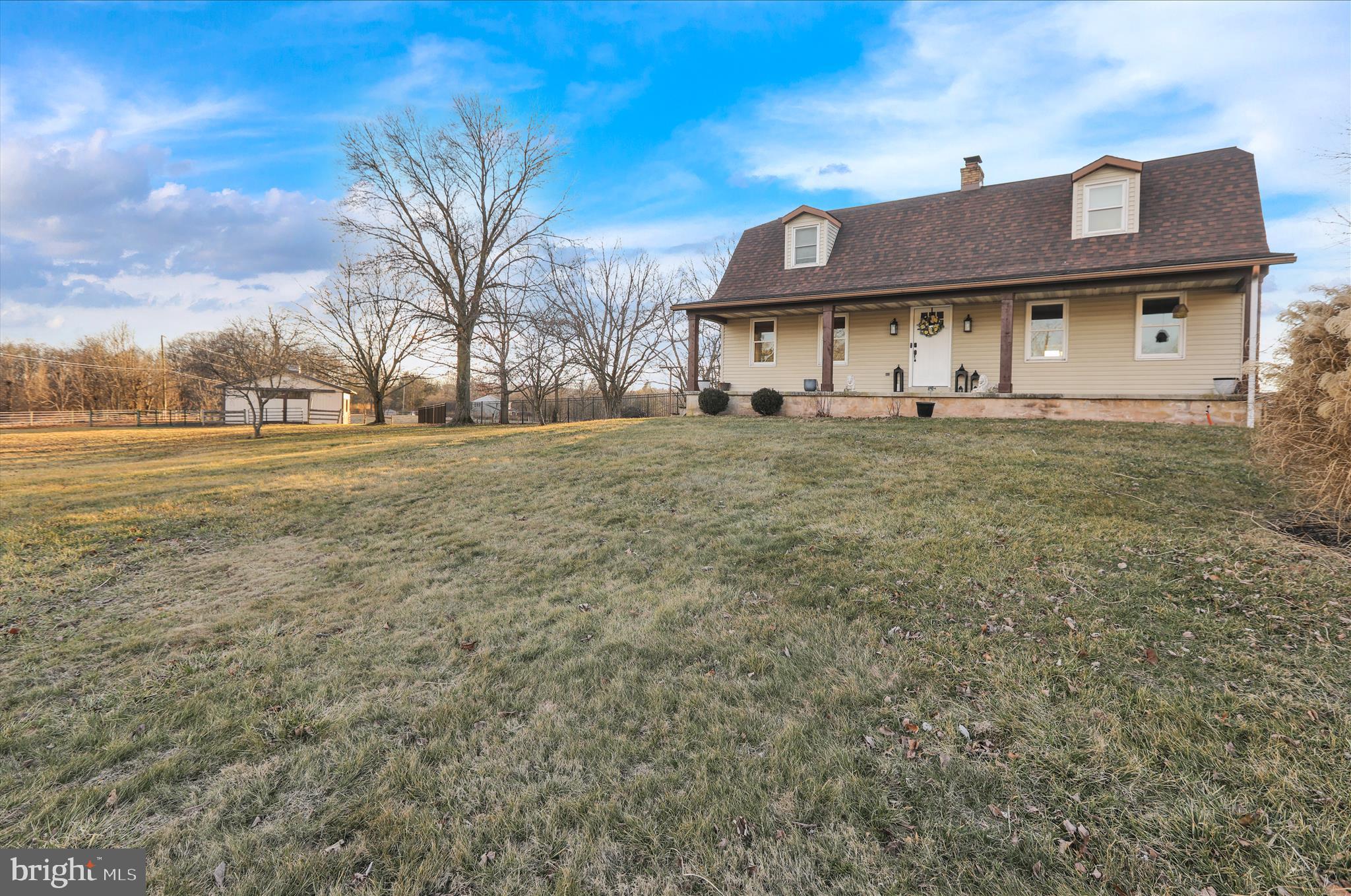 303 Gates Road Hershey, PA 17033 - Photo 1 of 53 a view of a big house with a big yard and large trees