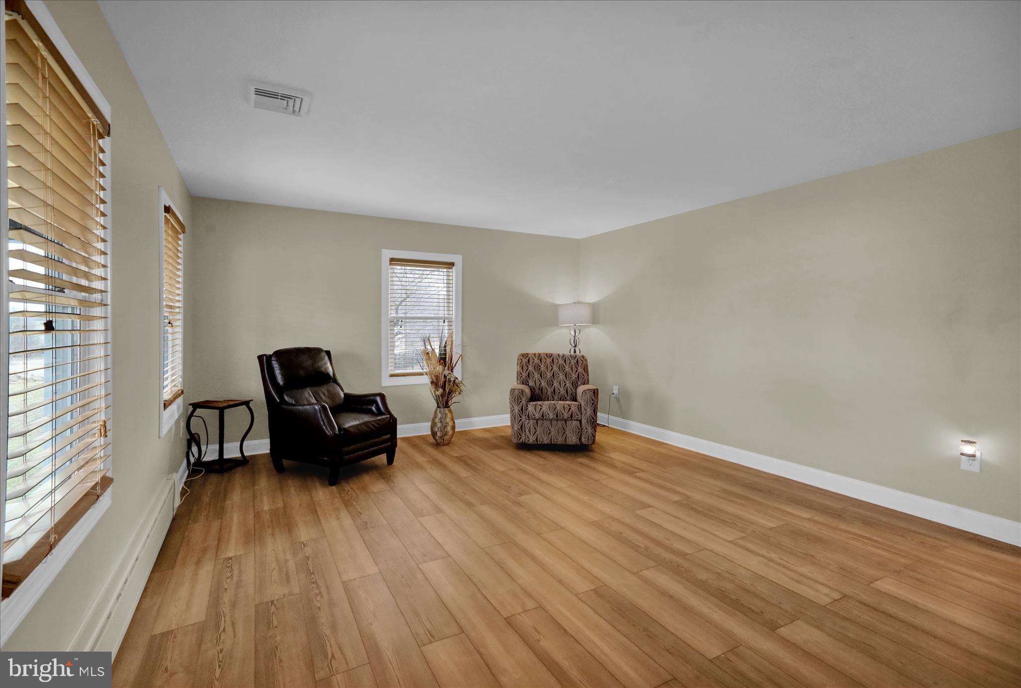 303 Gates Road Hershey, PA 17033 - Photo 17 of 53 a living room with furniture and a wooden floor