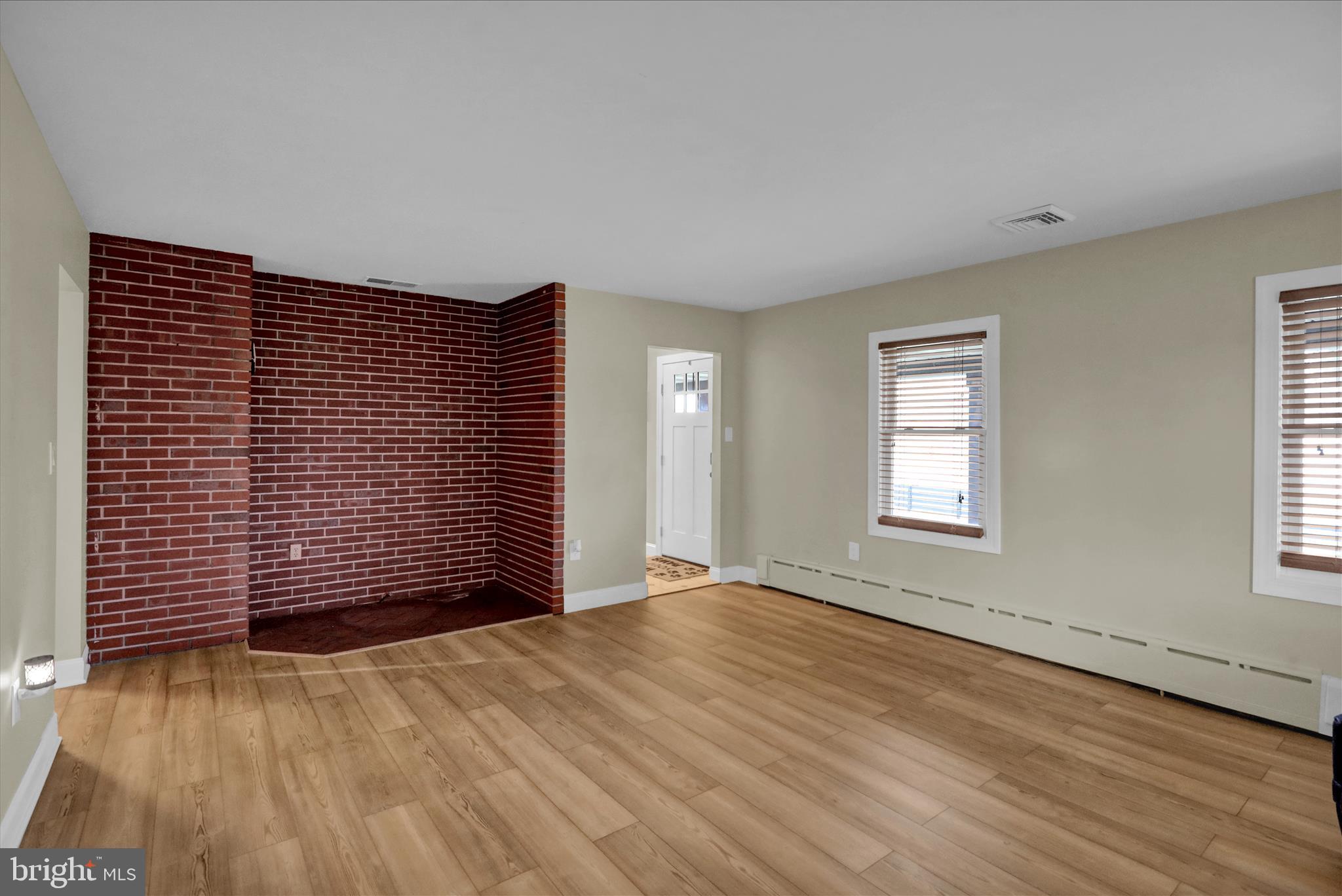 303 Gates Road Hershey, PA 17033 - Photo 19 of 53 an empty room with wooden floor and windows