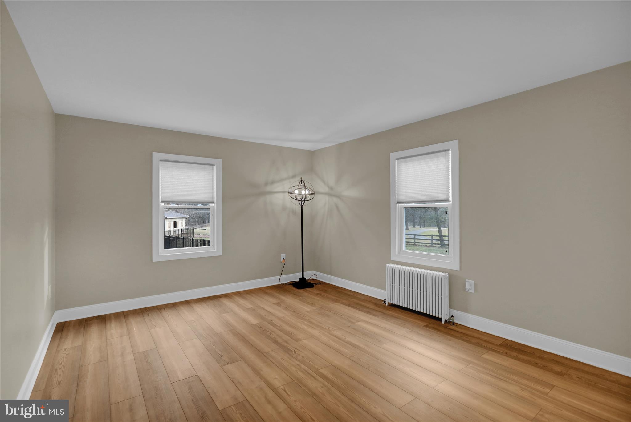 303 Gates Road Hershey, PA 17033 - Photo 21 of 53 a view of an empty room with a window and wooden floor