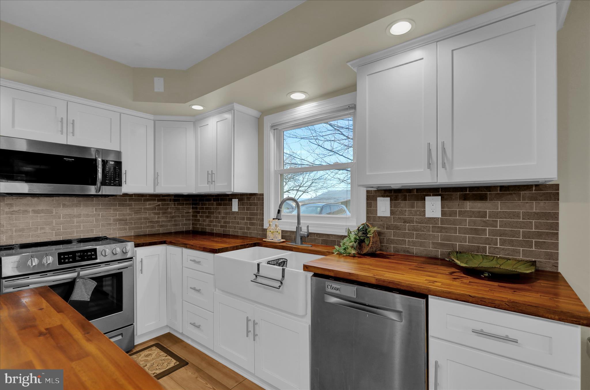 303 Gates Road Hershey, PA 17033 - Photo 29 of 53 a kitchen with stainless steel appliances granite countertop a sink stove and microwave