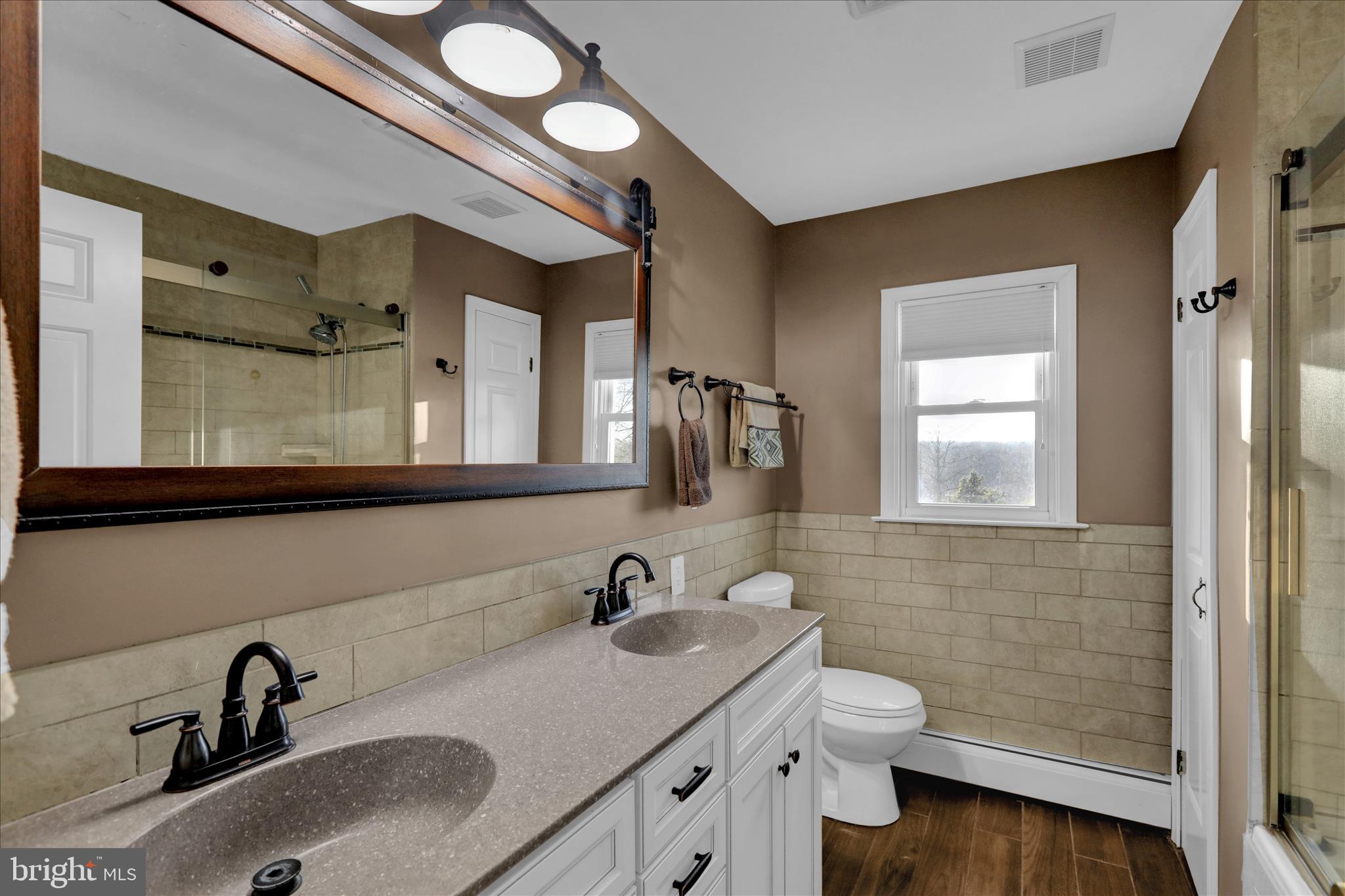 303 Gates Road Hershey, PA 17033 - Photo 36 of 53 a bathroom with a sink double vanity and a toilet