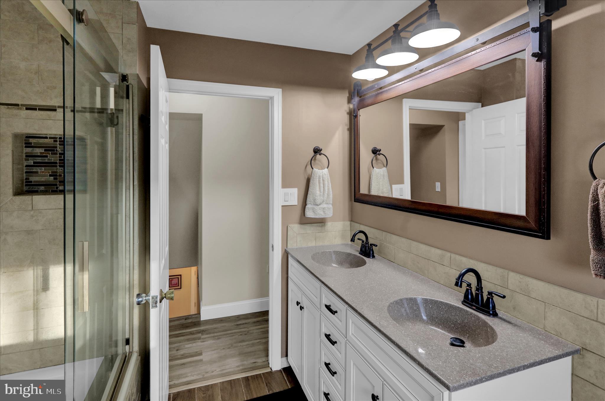 303 Gates Road Hershey, PA 17033 - Photo 37 of 53 a bathroom with a sink double vanity and a mirror