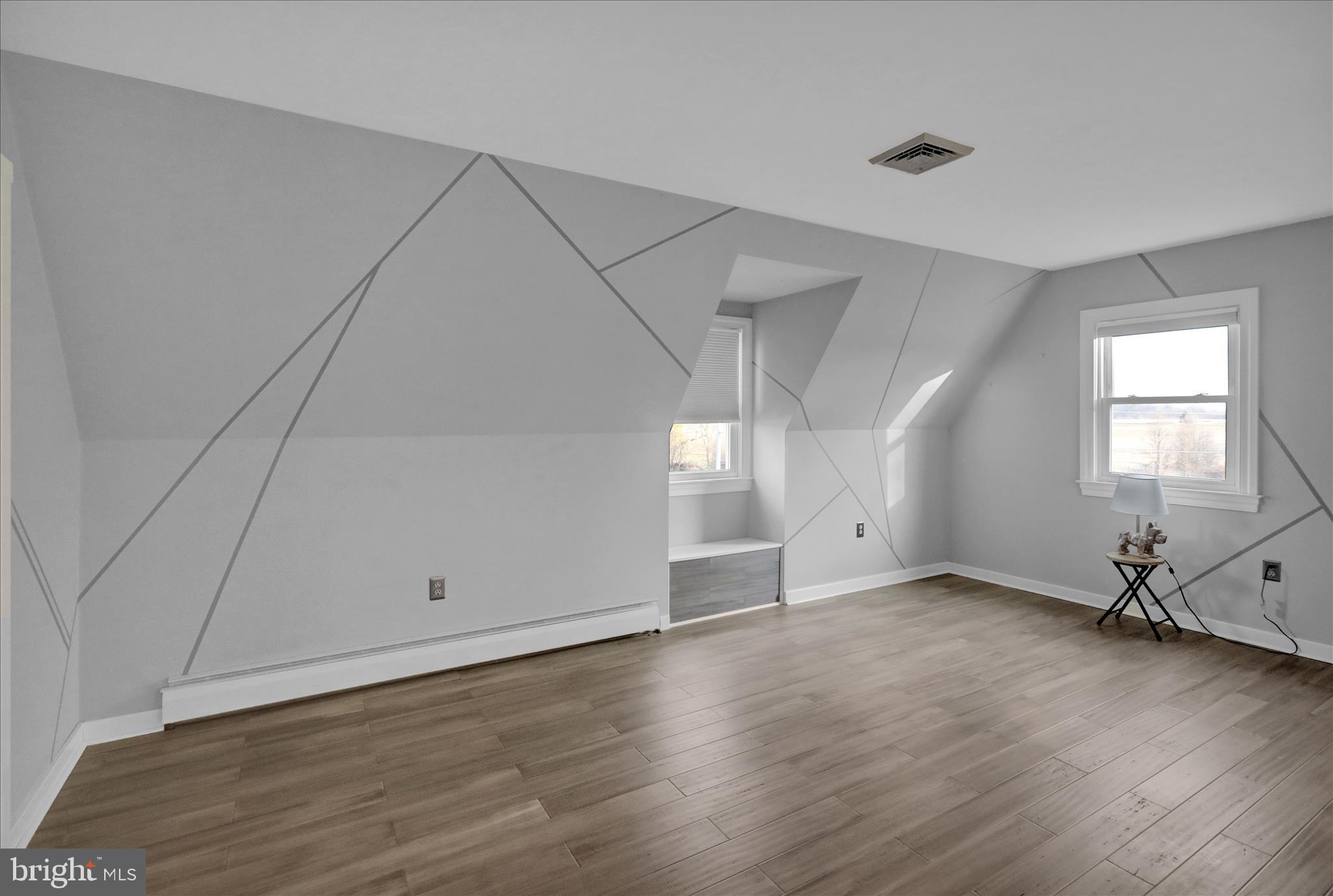 303 Gates Road Hershey, PA 17033 - Photo 40 of 53 an empty room with wooden floor and windows