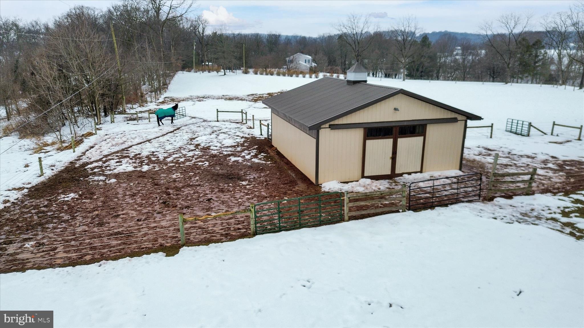 303 Gates Road Hershey, PA 17033 - Photo 10 of 53 a view of a house with a yard and covered with snow in the background