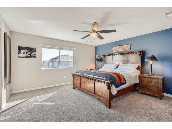 a bed room with a bed and a window