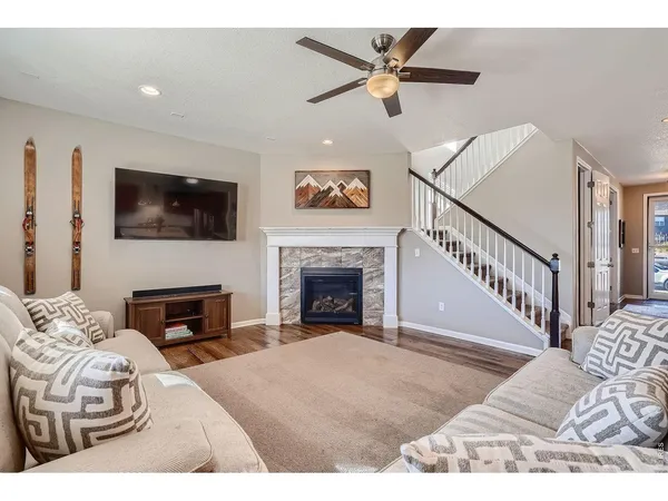 a view of a livingroom with furniture and a fireplace