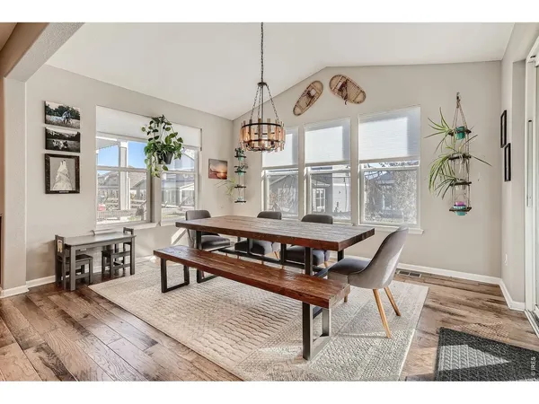a living room with furniture a window and a chandelier