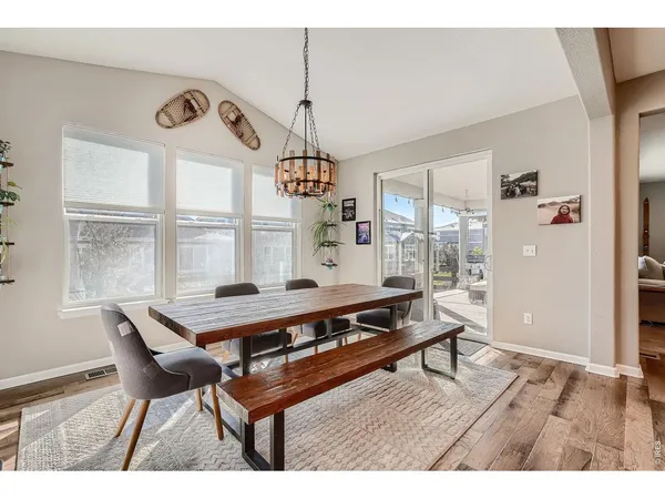 a living room with furniture a window and a chandelier