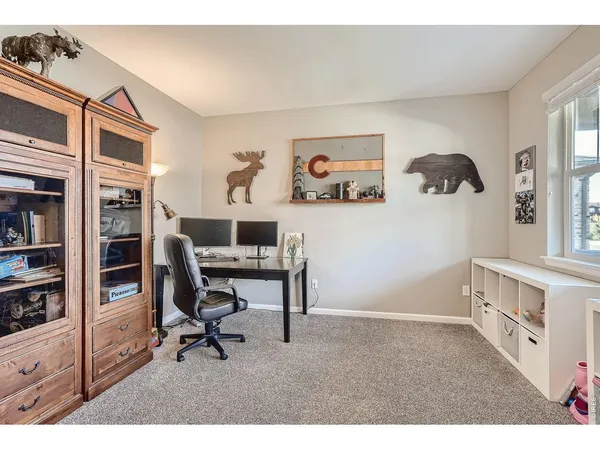 a view of a workspace with furniture