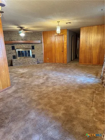 an empty room with wooden floor