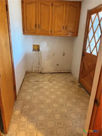 a view of storage and utility room with a sink