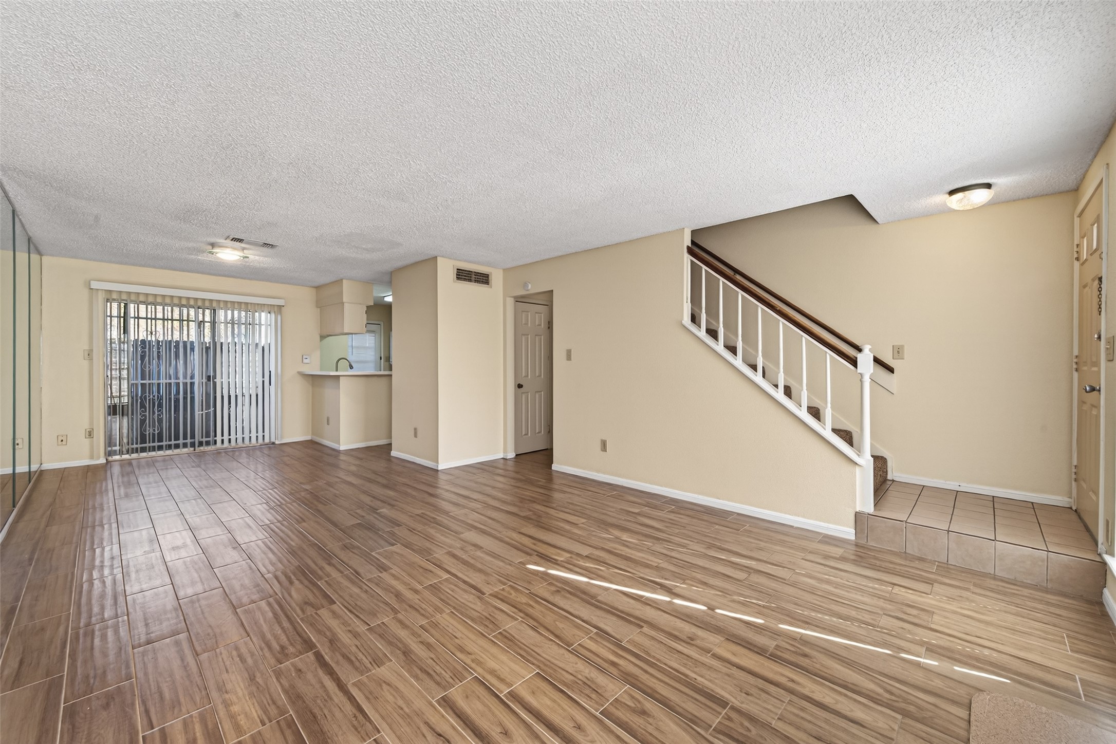 3100 Jeanetta Street, Unit 1004 Houston, TX 77063 - Photo 13 of 46 a view of empty room with wooden floor and fan
