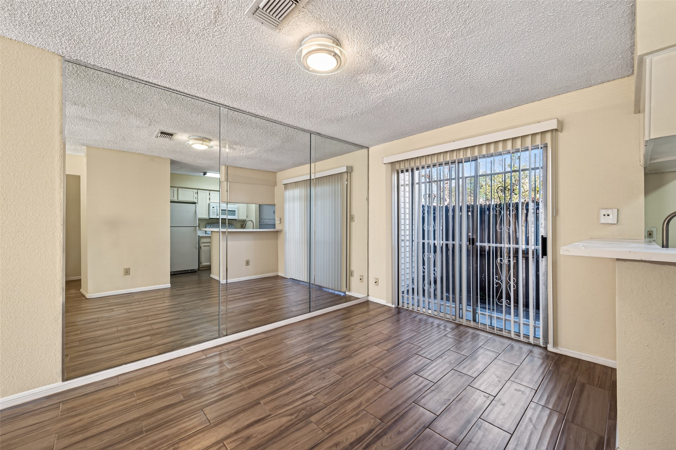 3100 Jeanetta Street, Unit 1004 Houston, TX 77063 - Photo 15 of 46 a view of a kitchen with wooden floor and a window