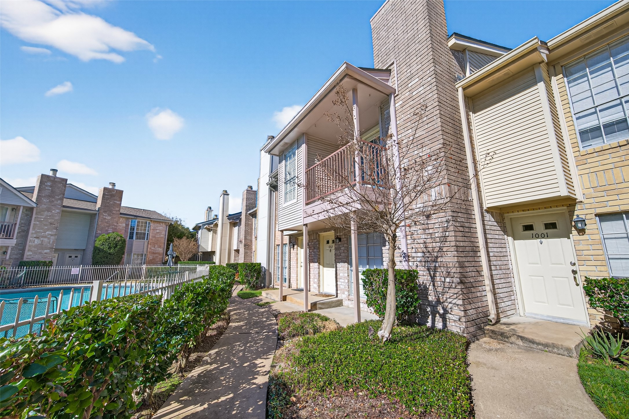 3100 Jeanetta Street, Unit 1004 Houston, TX 77063 - Photo 2 of 46 a view of a house with a yard and plants