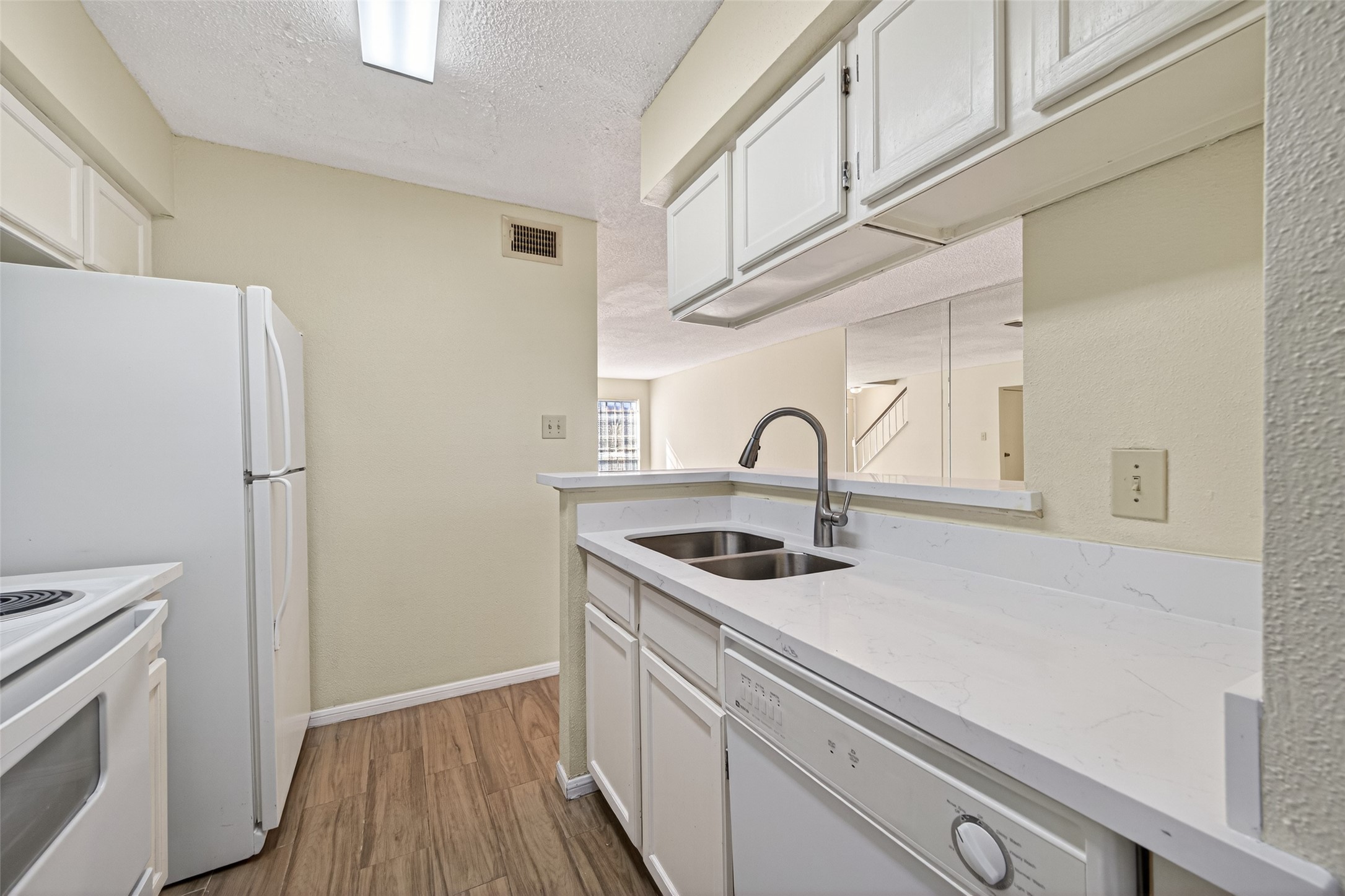 3100 Jeanetta Street, Unit 1004 Houston, TX 77063 - Photo 22 of 46 a kitchen with stainless steel appliances a sink and a refrigerator