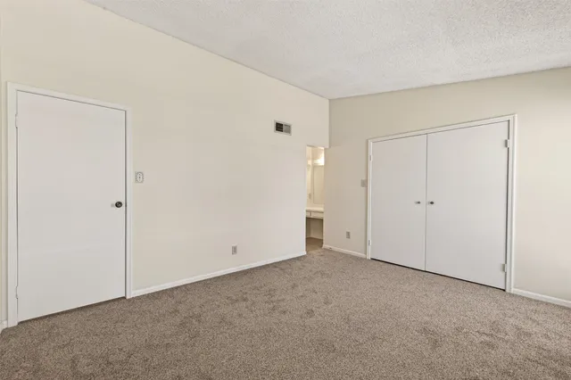 a white bath tub sitting next to a white toilet and sink