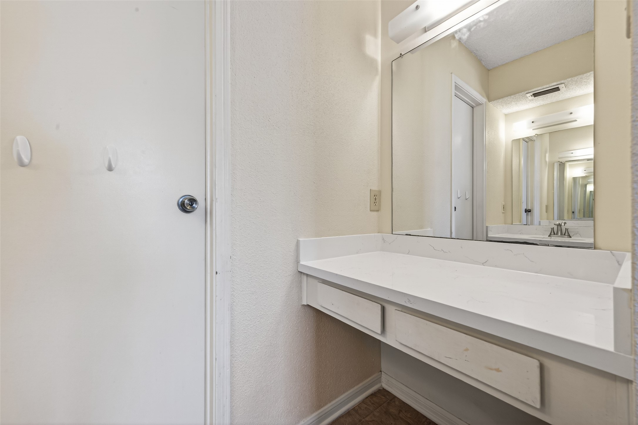 3100 Jeanetta Street, Unit 1004 Houston, TX 77063 - Photo 31 of 46 a bathroom with a sink and a mirror