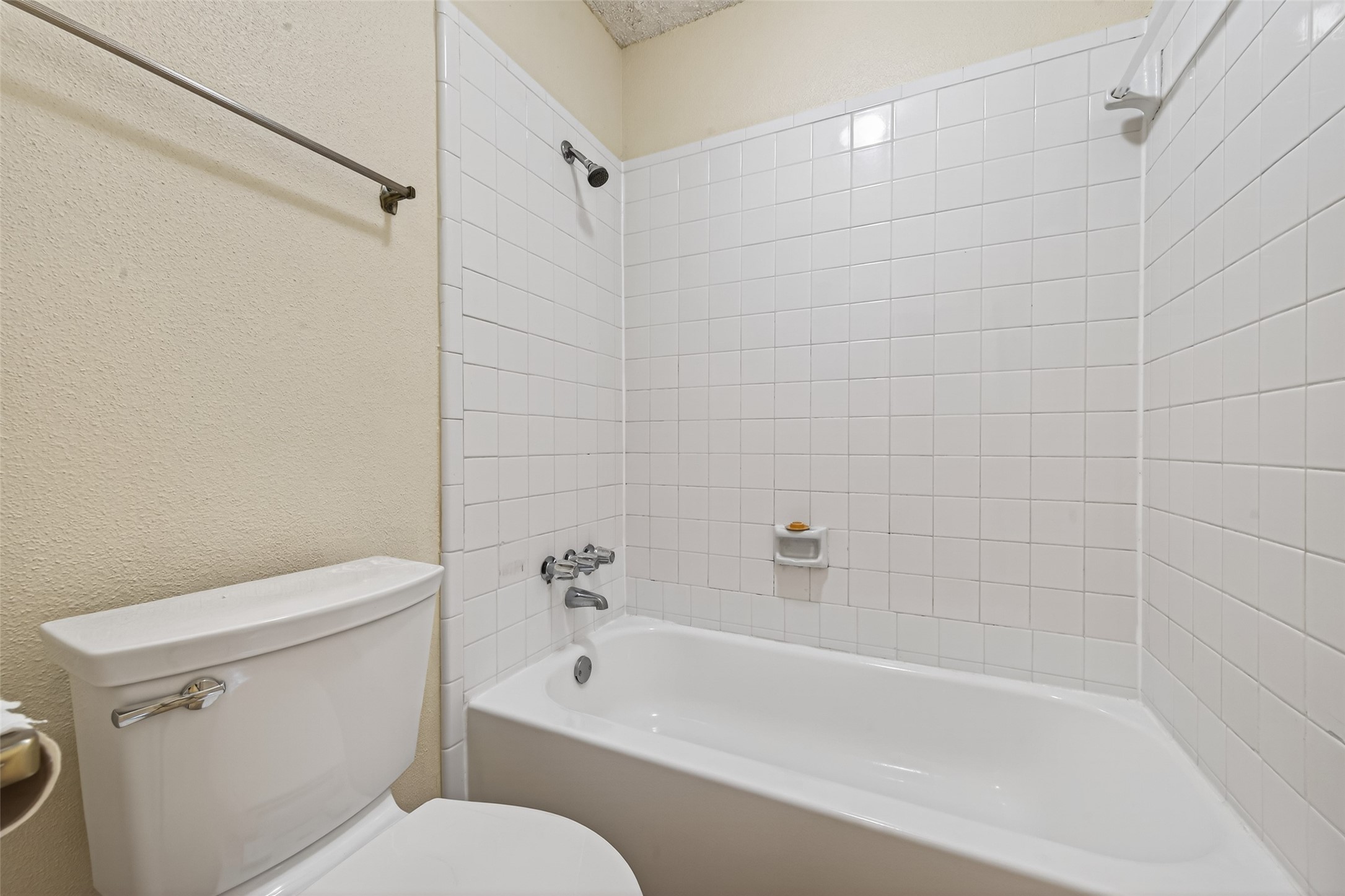 3100 Jeanetta Street, Unit 1004 Houston, TX 77063 - Photo 34 of 46 a white bath tub sitting next to a white toilet and sink