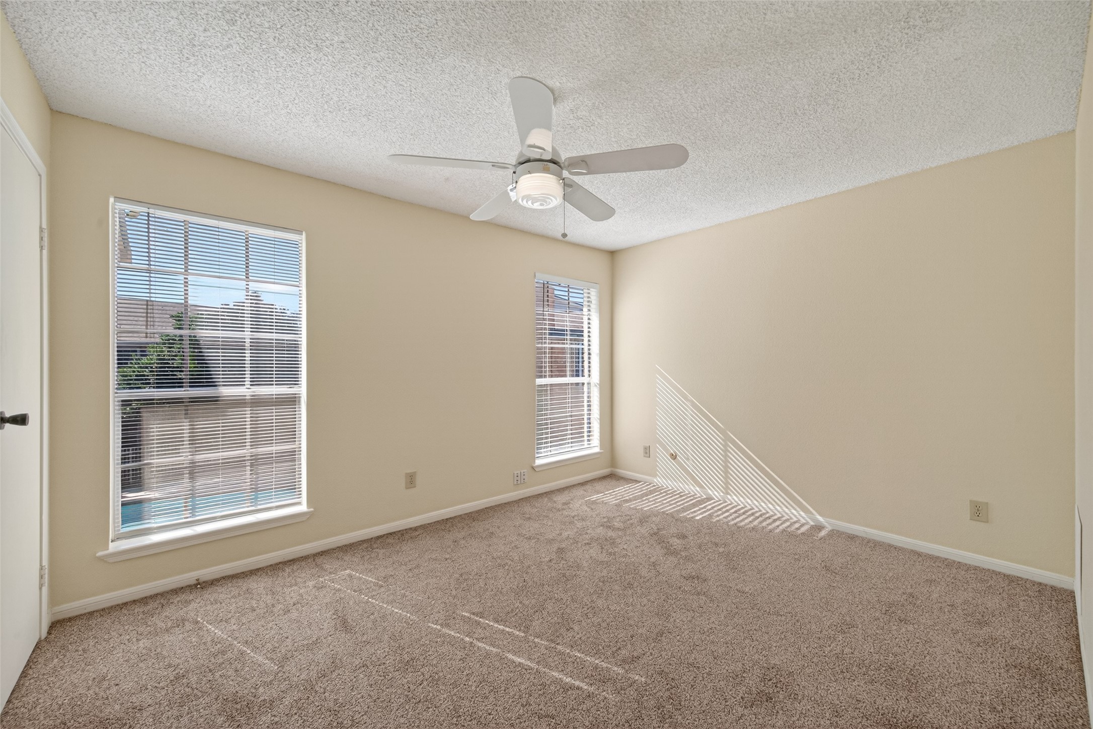 3100 Jeanetta Street, Unit 1004 Houston, TX 77063 - Photo 35 of 46 an empty room with windows and fan