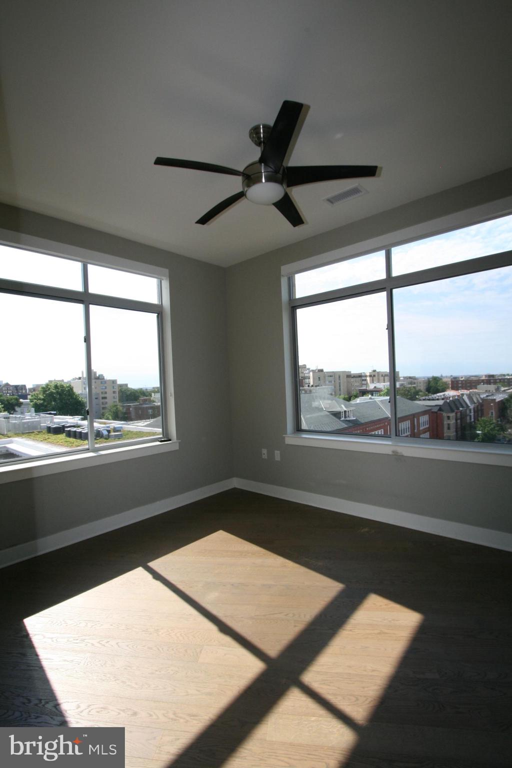 2550 17th Street Northwest, Unit 612 Washington, DC 20009 - Photo 41 of 55 a view of a big room with wooden floor and windows