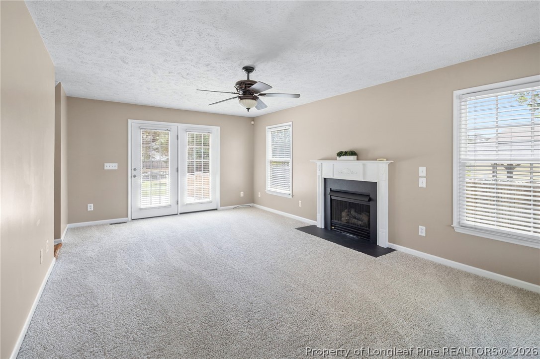 28 Coyt Circle Spring Lake, NC 28390 - Photo 7 of 41 a view of empty room with a fireplace and windows