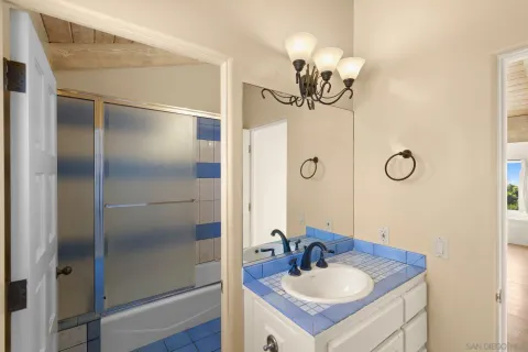 a bathroom with a sink double vanity and a mirror