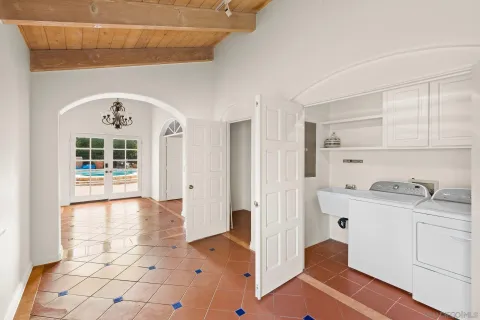 a spacious bathroom with a tub sink and mirror