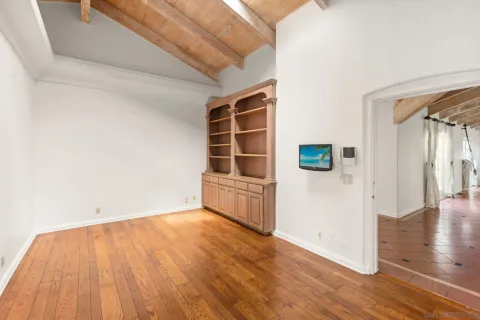 a spacious bathroom with a tub sink and mirror