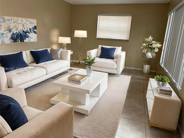 a living room with furniture and a lamp