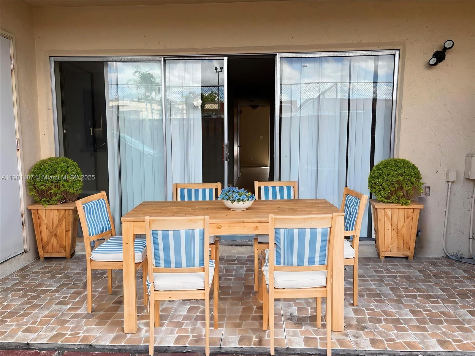 6541 Southwest 41st Court, Unit 173 Davie, FL 33314 - Photo 13 of 24 a dining room with furniture and wooden floor