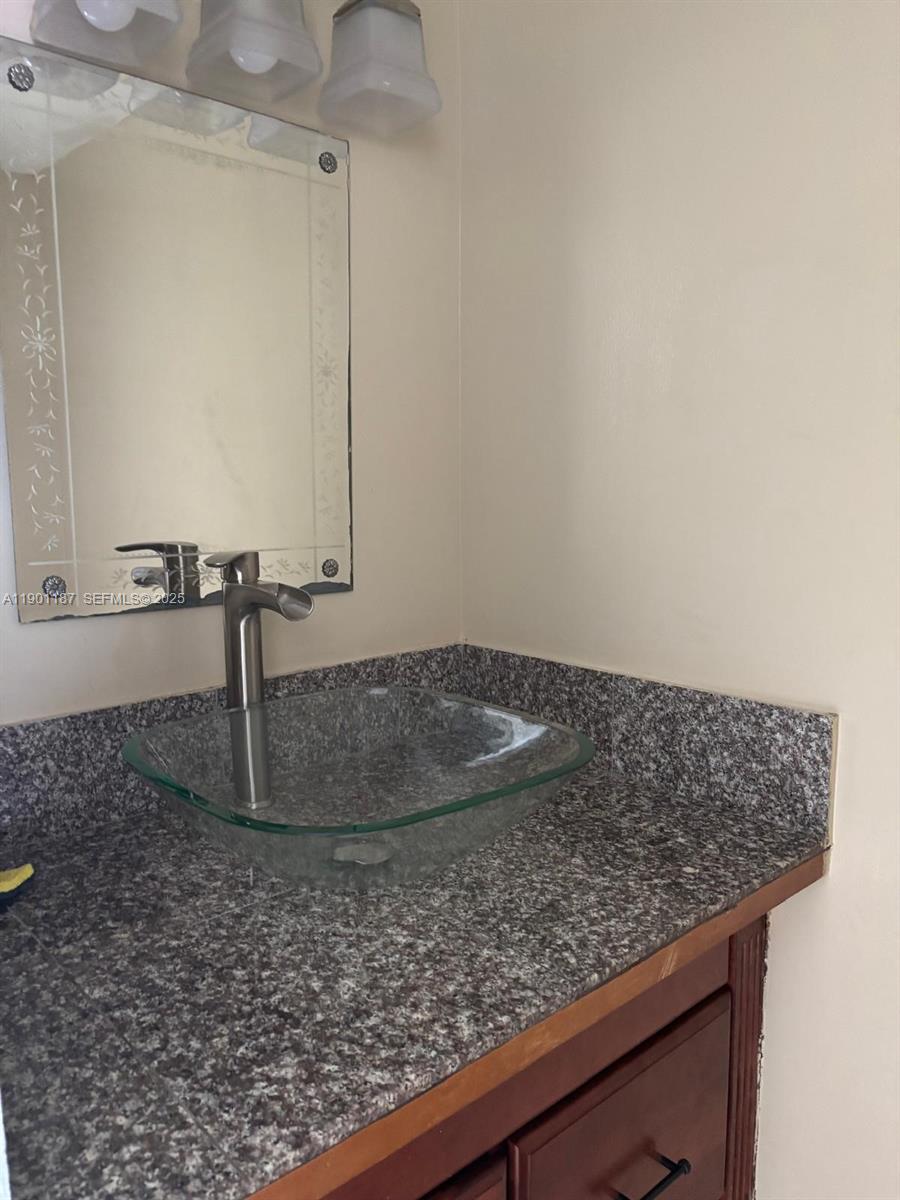 6541 Southwest 41st Court, Unit 173 Davie, FL 33314 - Photo 24 of 24 a view of a faucet cabinets