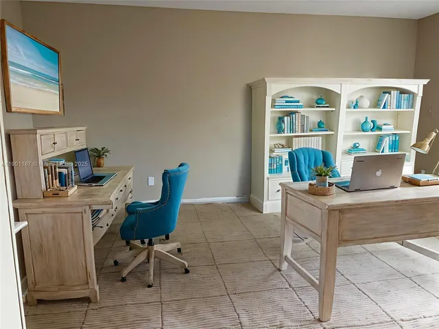 a work place with furniture and book shelf