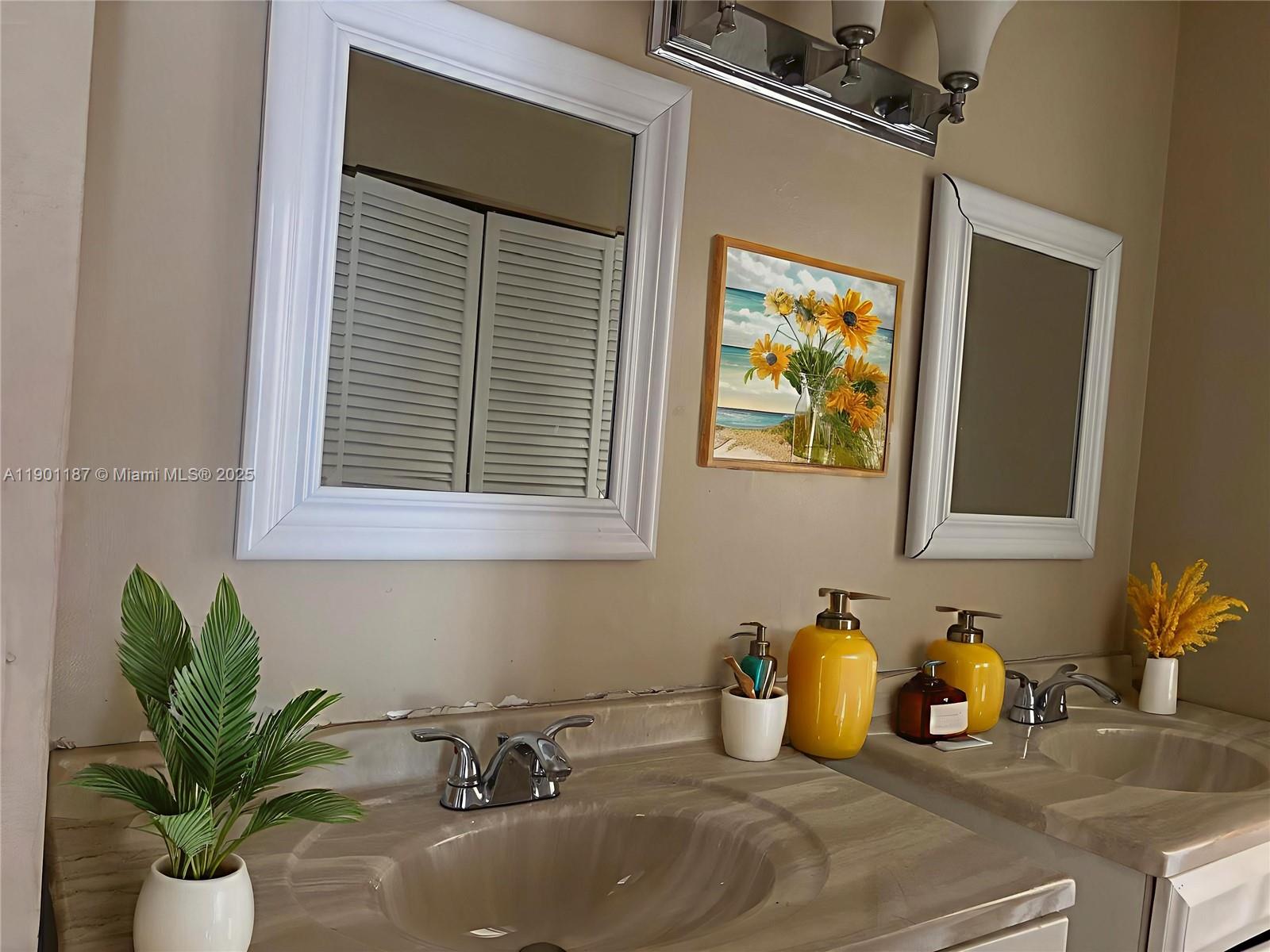 6541 Southwest 41st Court, Unit 173 Davie, FL 33314 - Photo 7 of 24 a bathroom with a granite countertop sink a mirror and a window