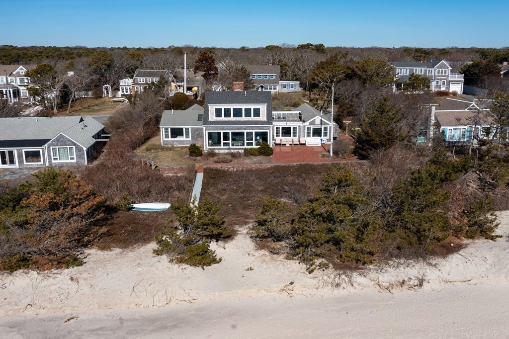 19 Shore Road Harwich, MA 02671 - Photo 3 of 30 an aerial view of residential houses with outdoor space and trees