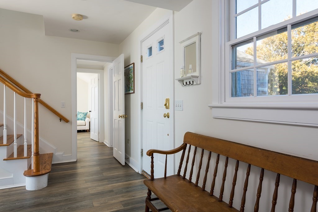 19 Shore Road Harwich, MA 02671 - Photo 8 of 30 a view of an entryway with wooden floor and door