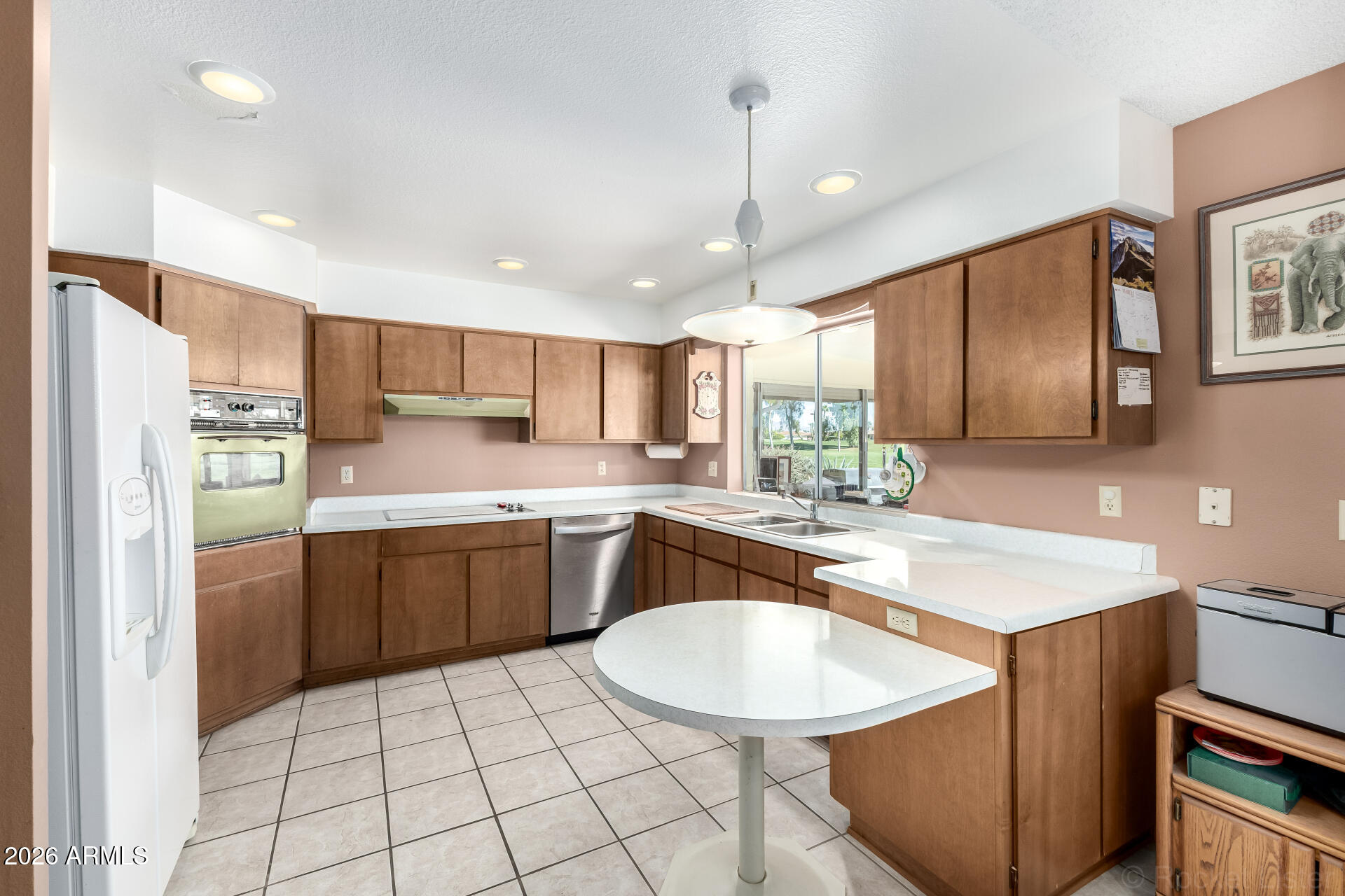 955 South Rochester Mesa, AZ 85206 - Photo 11 of 32 a kitchen with stainless steel appliances granite countertop a sink counter space cabinets and a counter top space