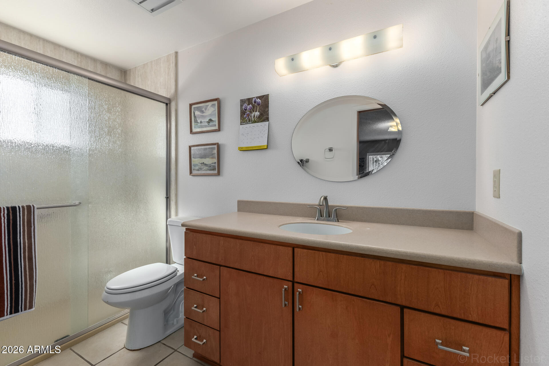 955 South Rochester Mesa, AZ 85206 - Photo 14 of 32 a bathroom with a toilet a sink and mirror